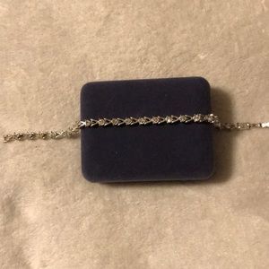 Silver and lab created white sapphire bracelet.